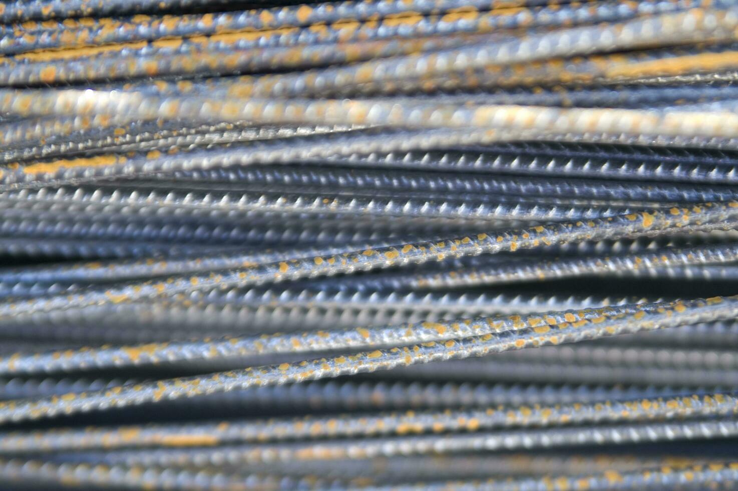 a pile of steel bars with rust on them photo