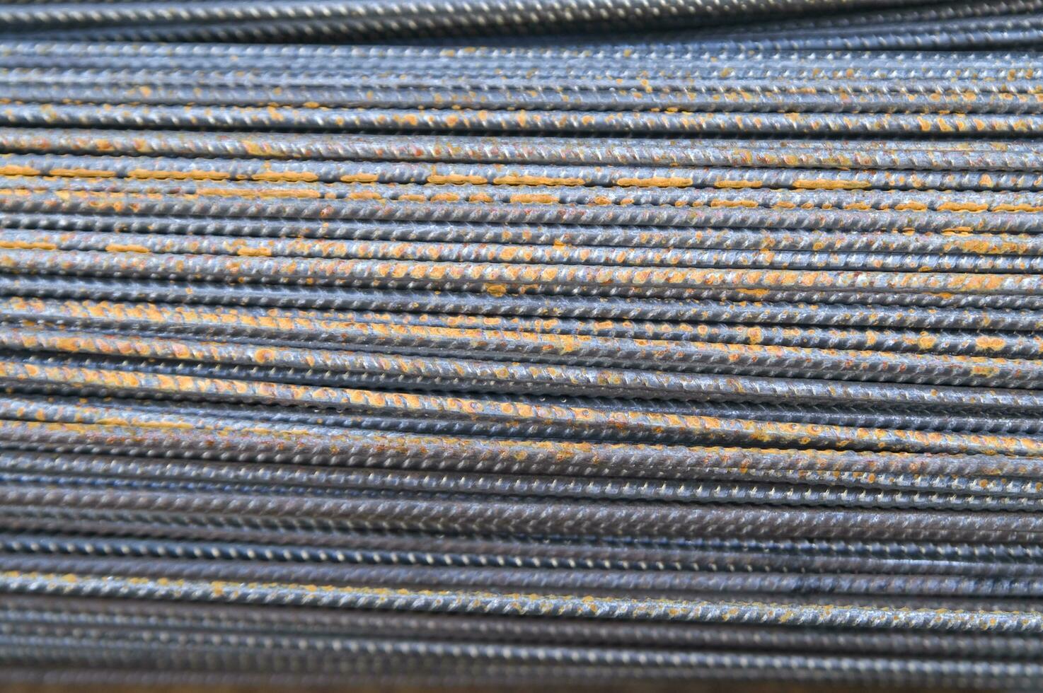 a pile of steel bars with rust on them photo