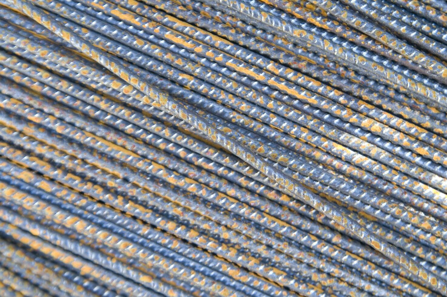 a pile of steel bars with rust on them photo