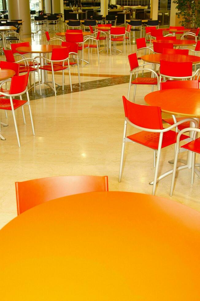a table and chairs in a restaurant photo