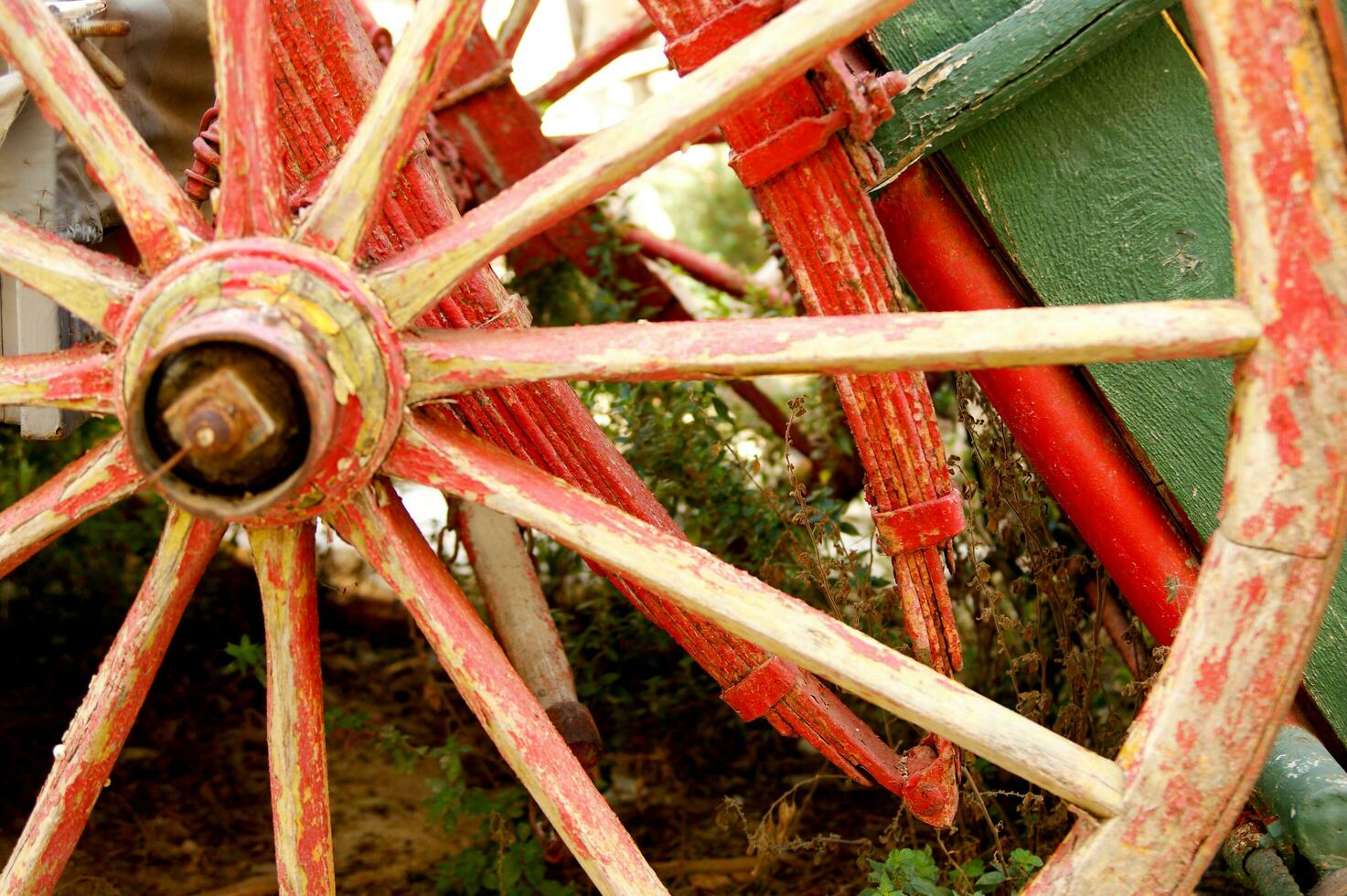 Ancient wooden wheel of an old wagon photo
