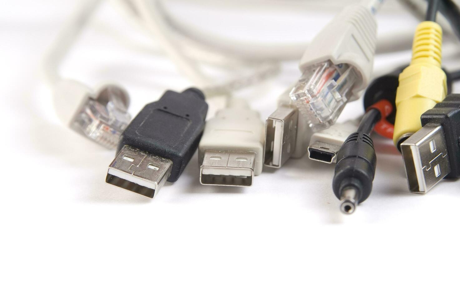 a hand holding several different types of cables photo