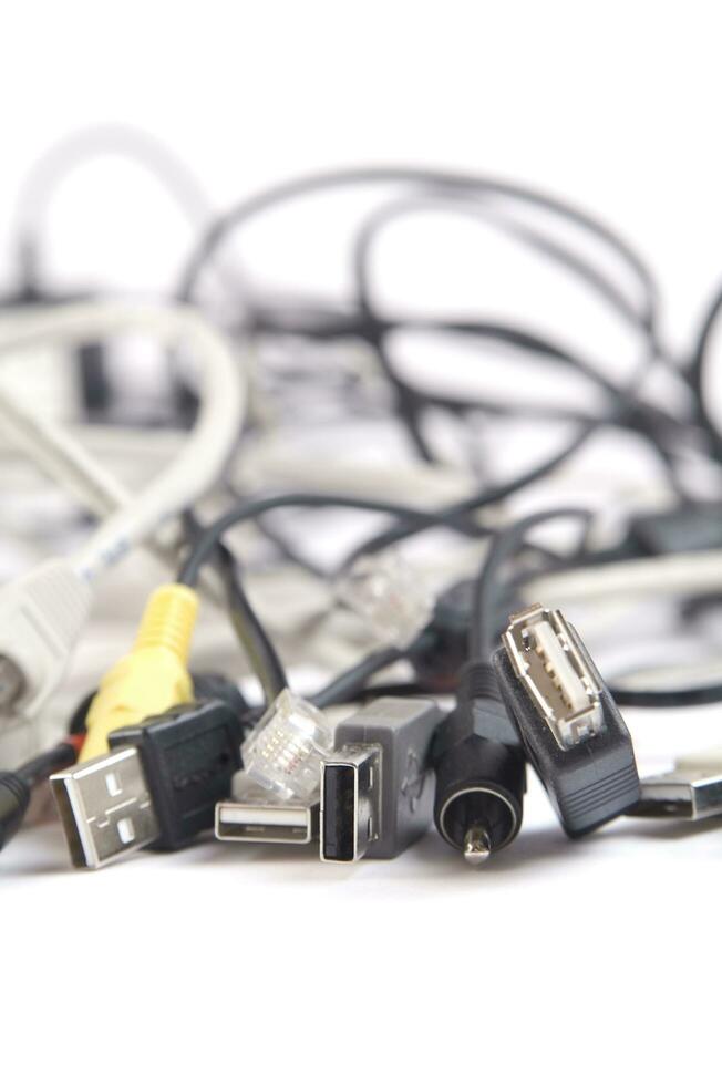 a hand holding several different types of cables photo