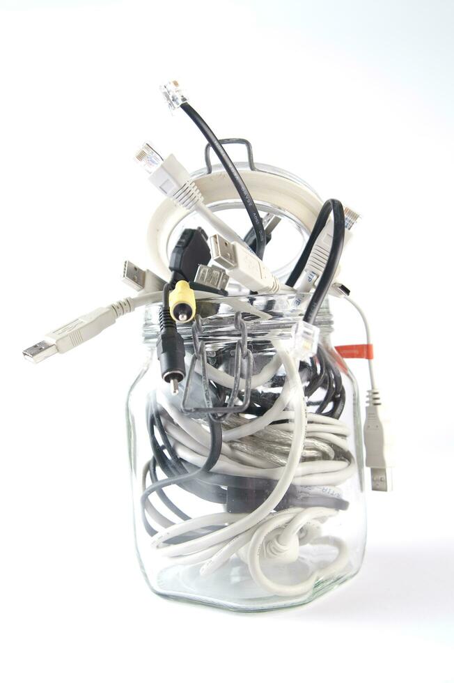 a glass jar filled with wires photo