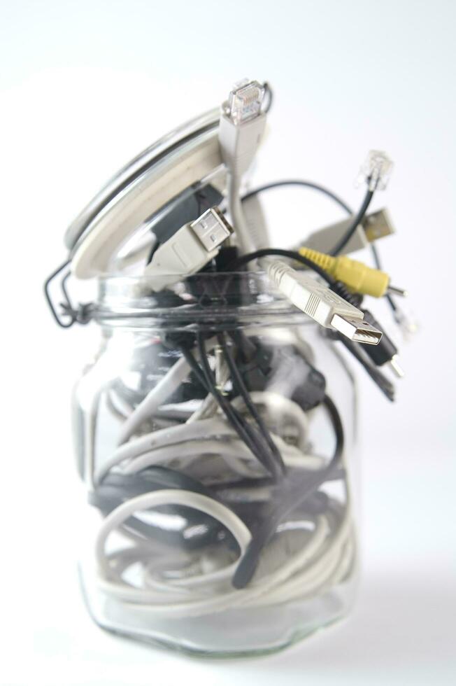 a glass jar filled with wires photo
