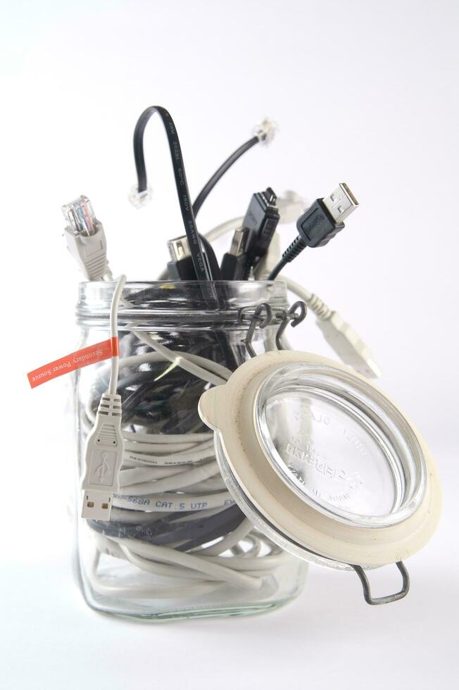 a glass jar filled with wires photo