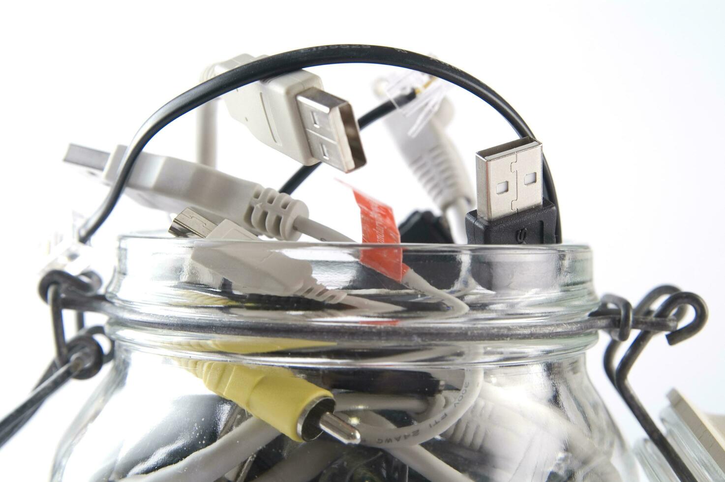 a glass jar filled with wires photo
