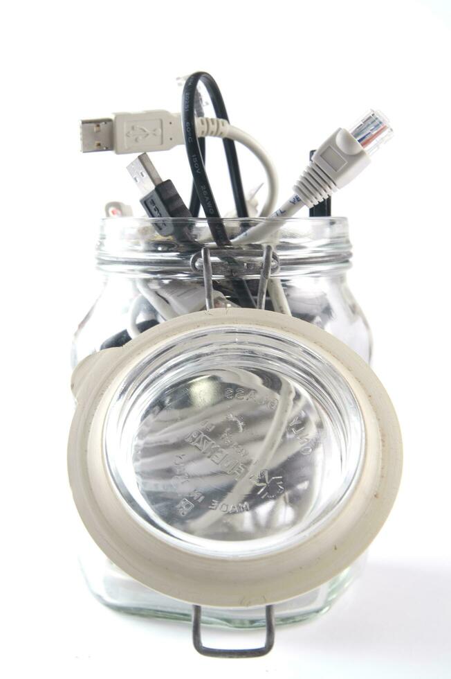 a glass jar filled with wires photo