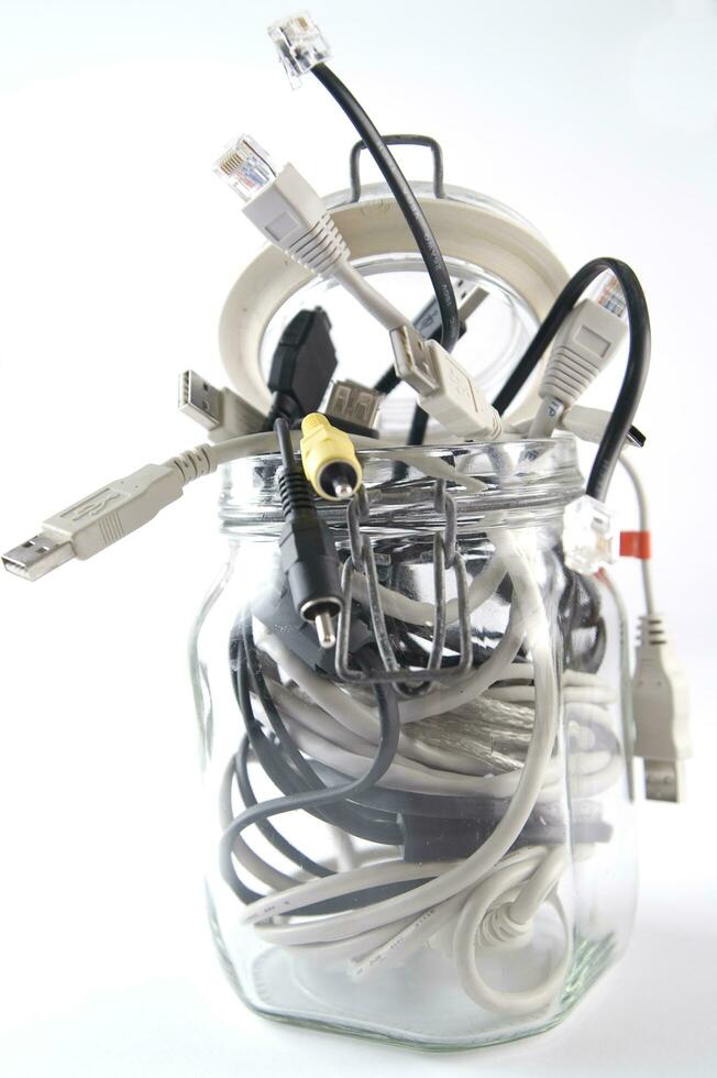 a glass jar filled with wires photo