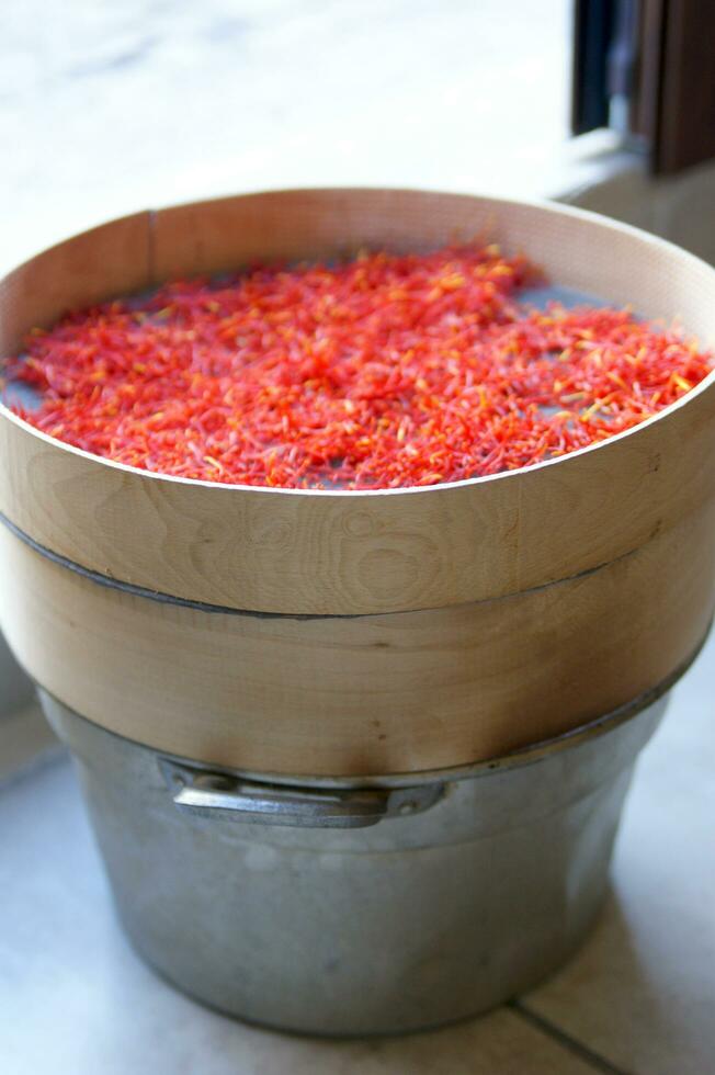 a pile of red saffron on a plate photo