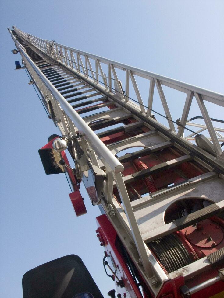 a tall metal tower with a blue sky in the background photo