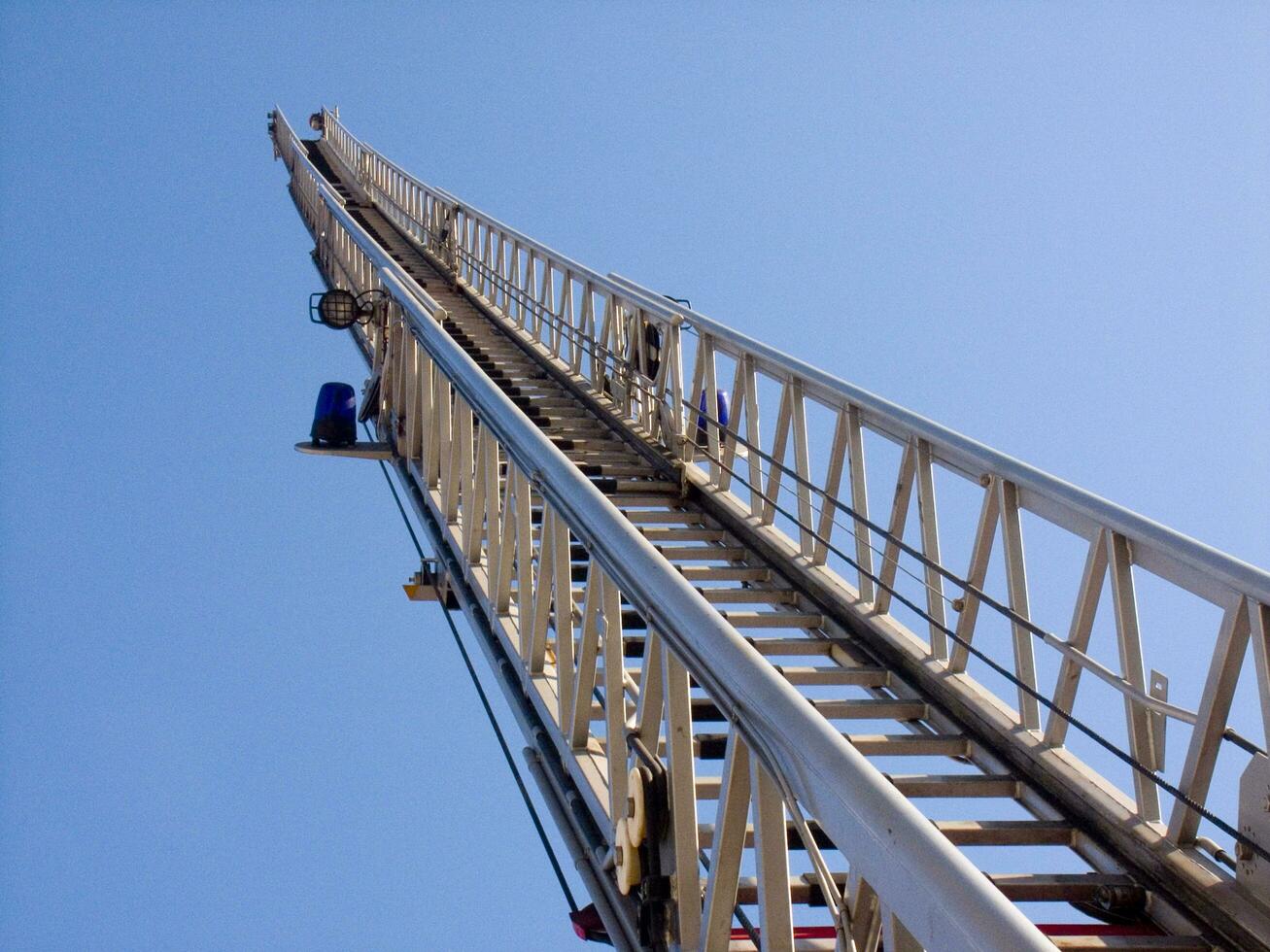 a tall metal tower with a blue sky in the background photo