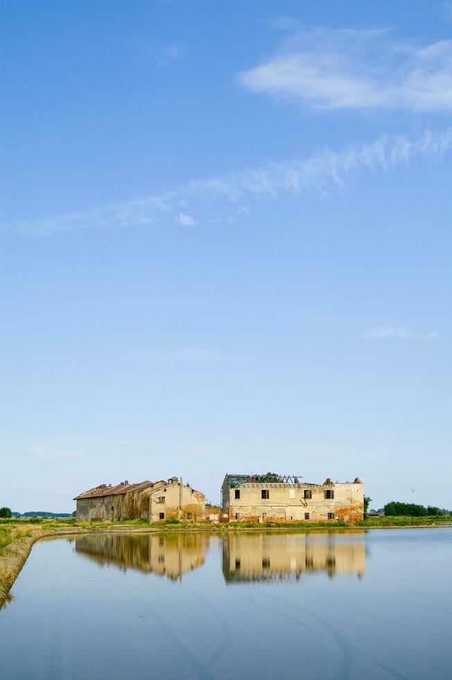 ancient farms in the rice fields in Vercelli Italy photo