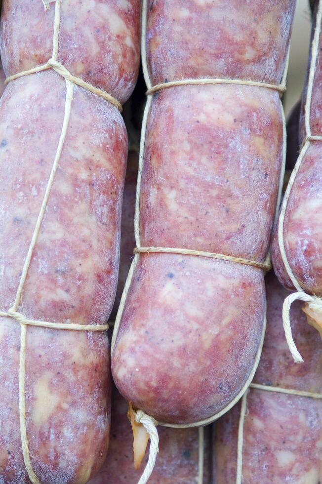 a pile of sausages wrapped in rope photo