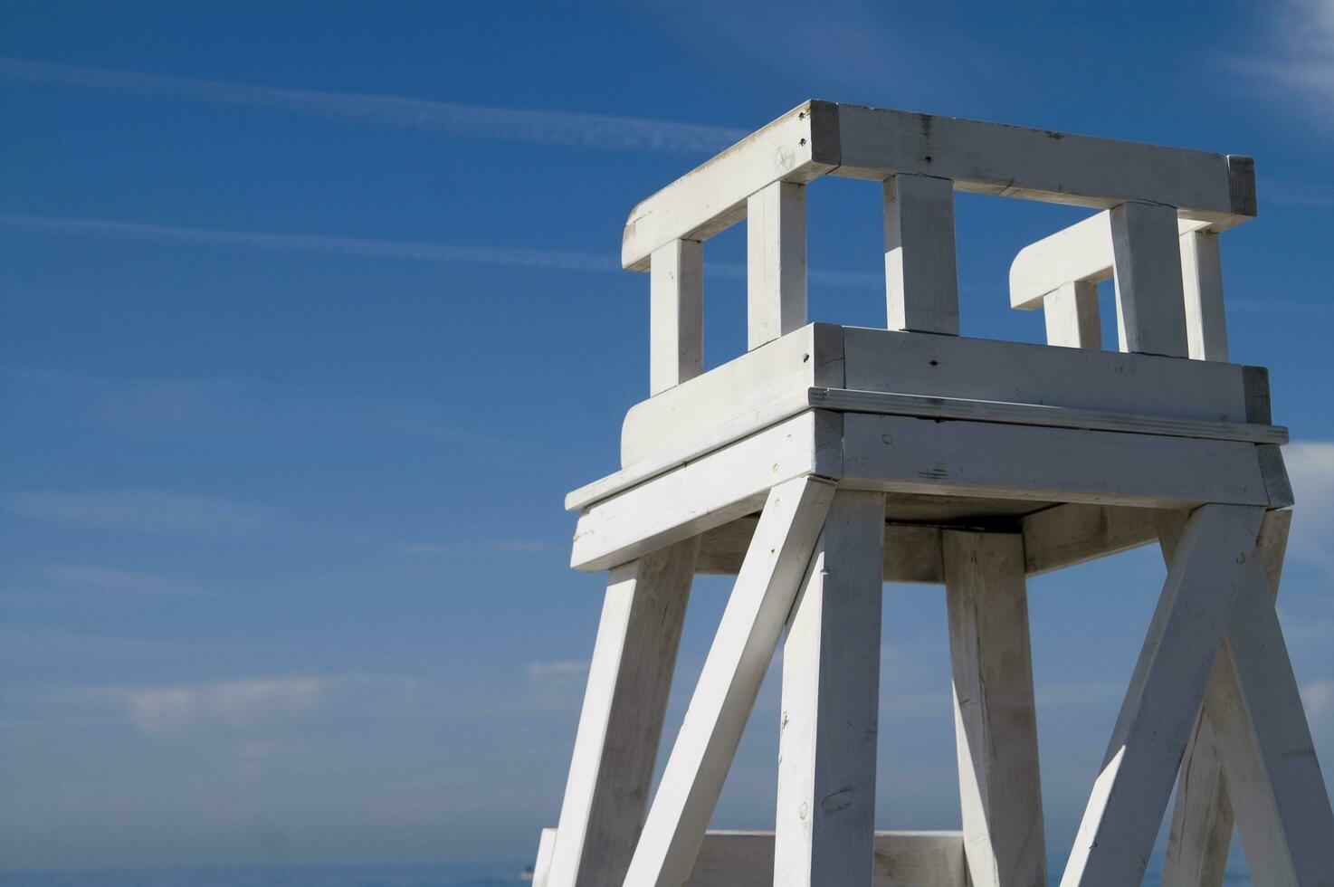 a lifeguard chair sitting on a beach photo