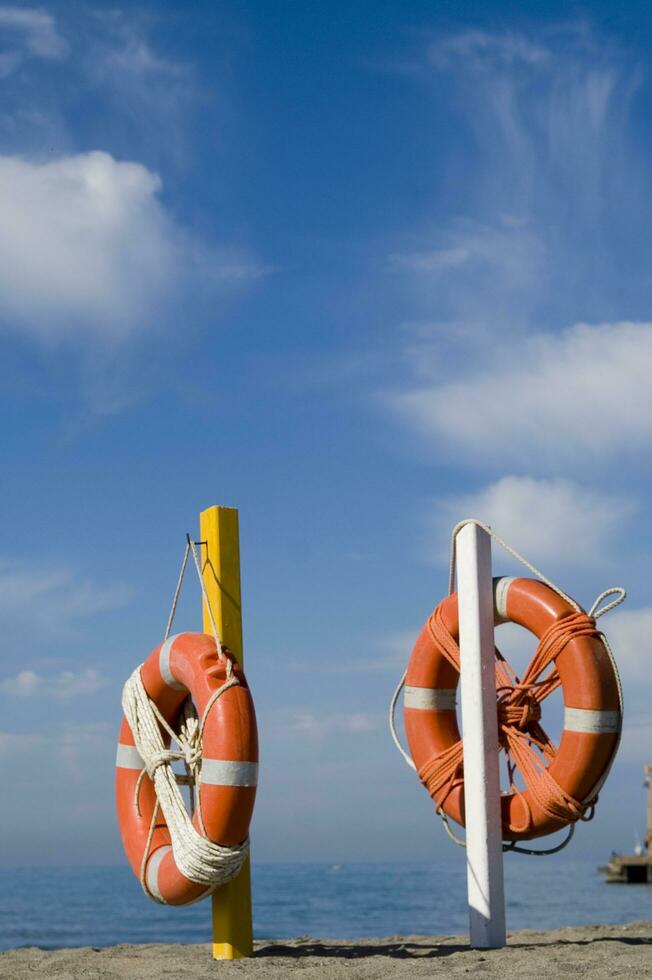 two life preservers on a beach photo