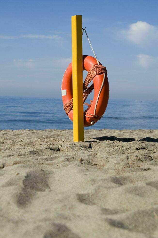 two life preservers on a beach photo