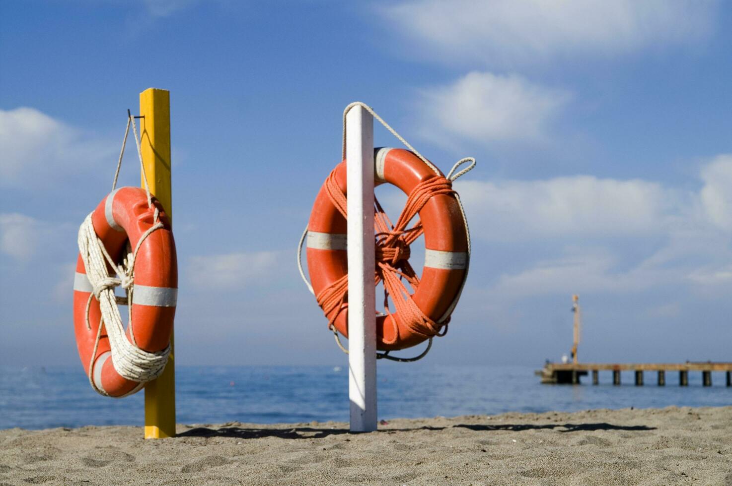 two life preservers on a beach photo