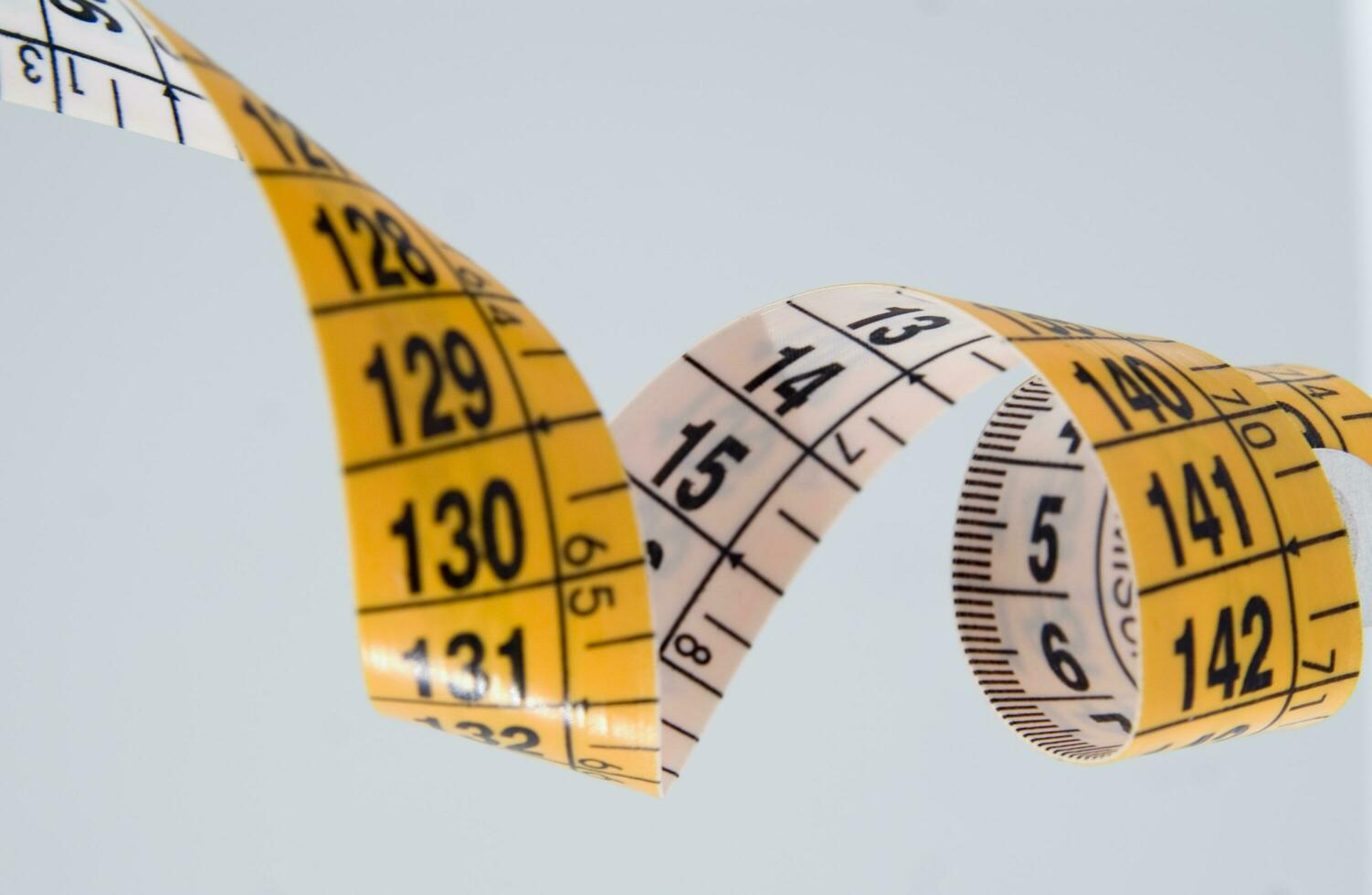 a close up of a measuring tape with numbers photo