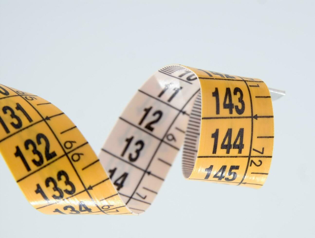 a close up of a measuring tape with numbers photo