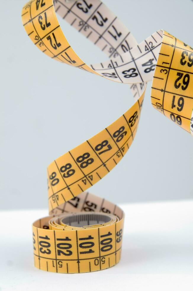 a close up of a measuring tape with numbers photo