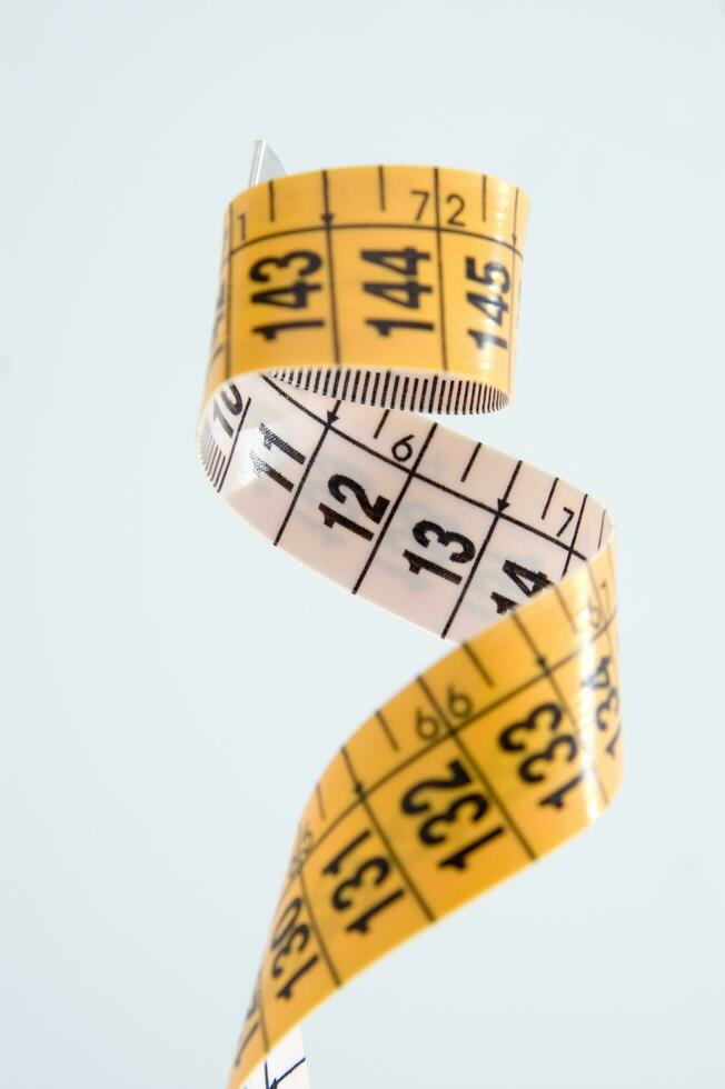 a close up of a measuring tape with numbers photo