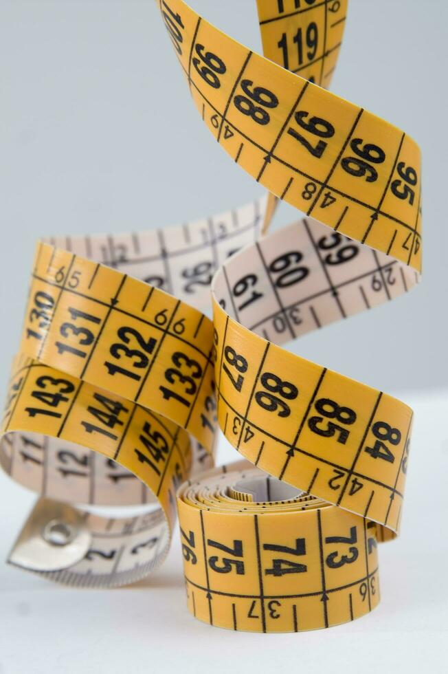 a close up of a measuring tape with numbers photo