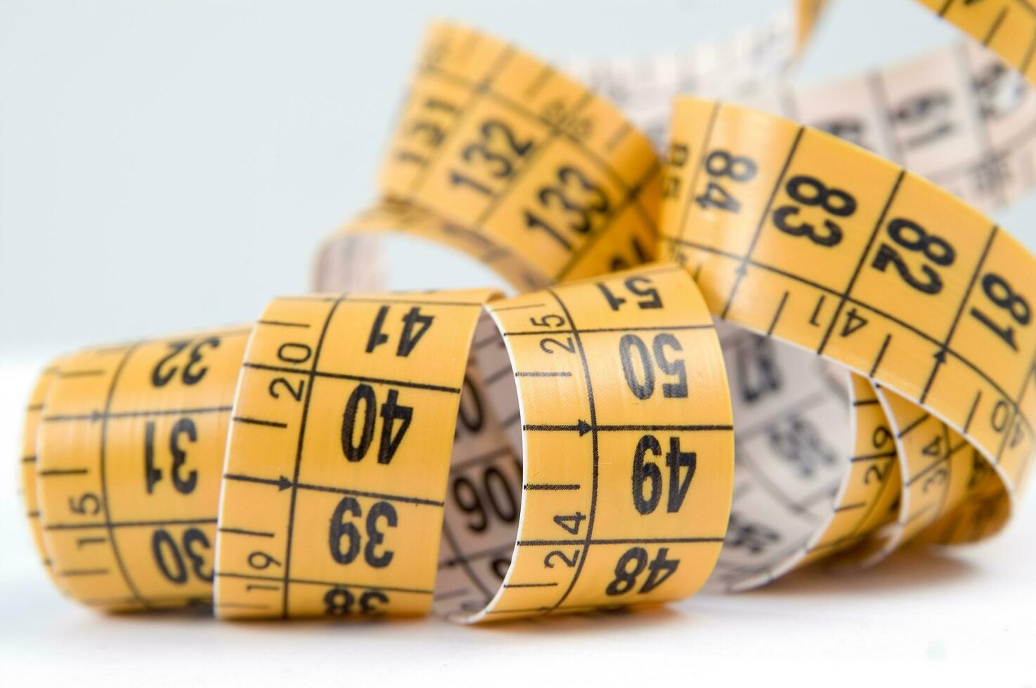 a close up of a measuring tape with numbers photo