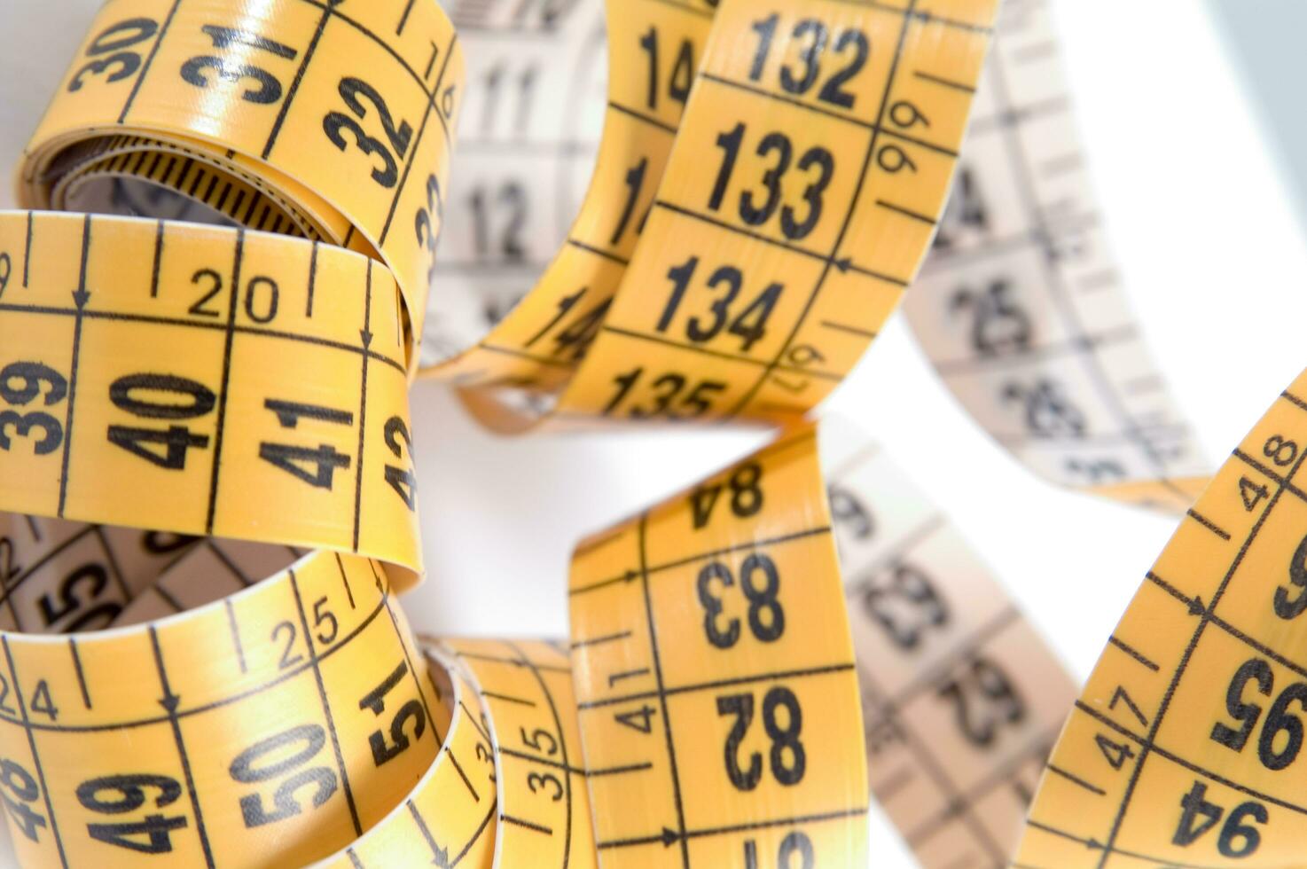 a close up of a measuring tape with numbers photo