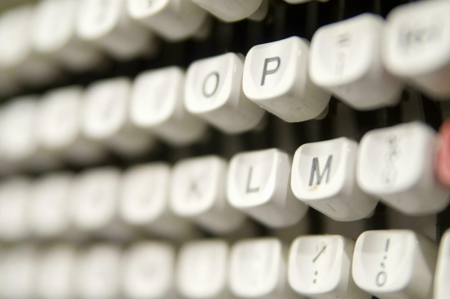 a close up of a typewriter keyboard with the letters oop photo