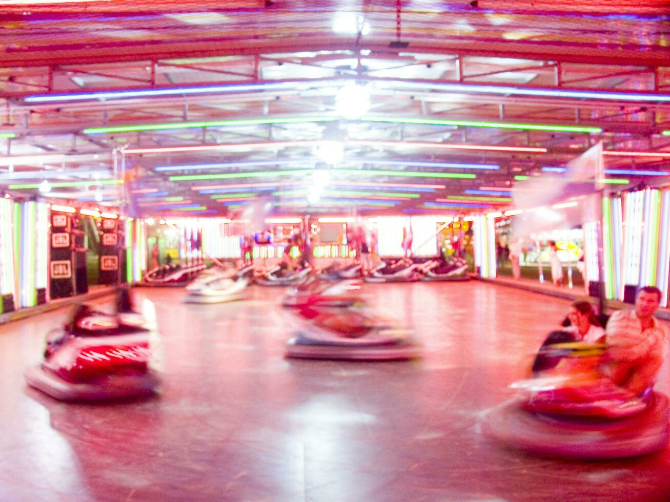 view of a funfair at night photo