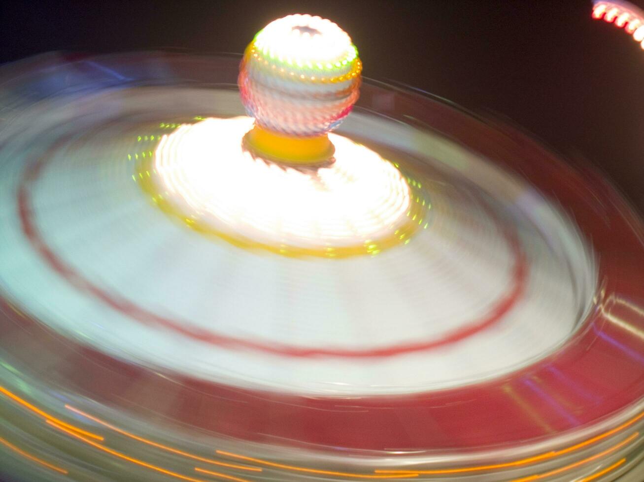 view of a funfair at night photo