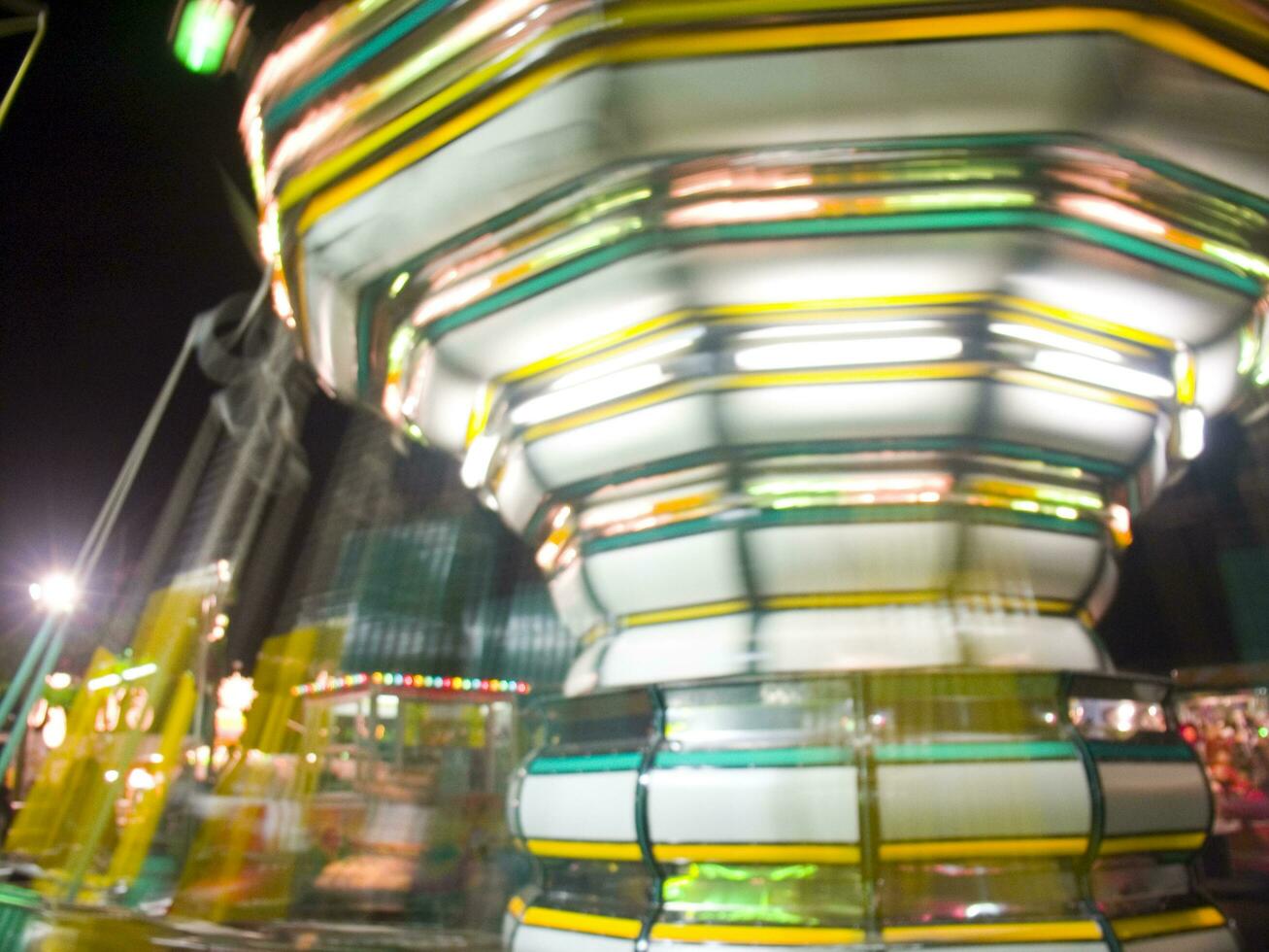 view of a funfair at night photo