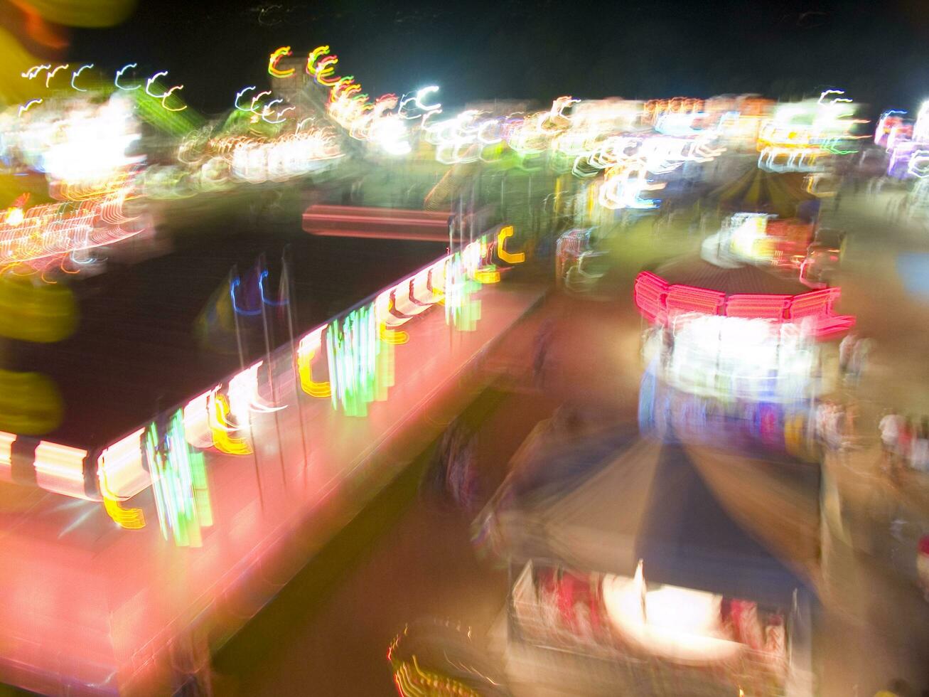 view of a funfair at night photo