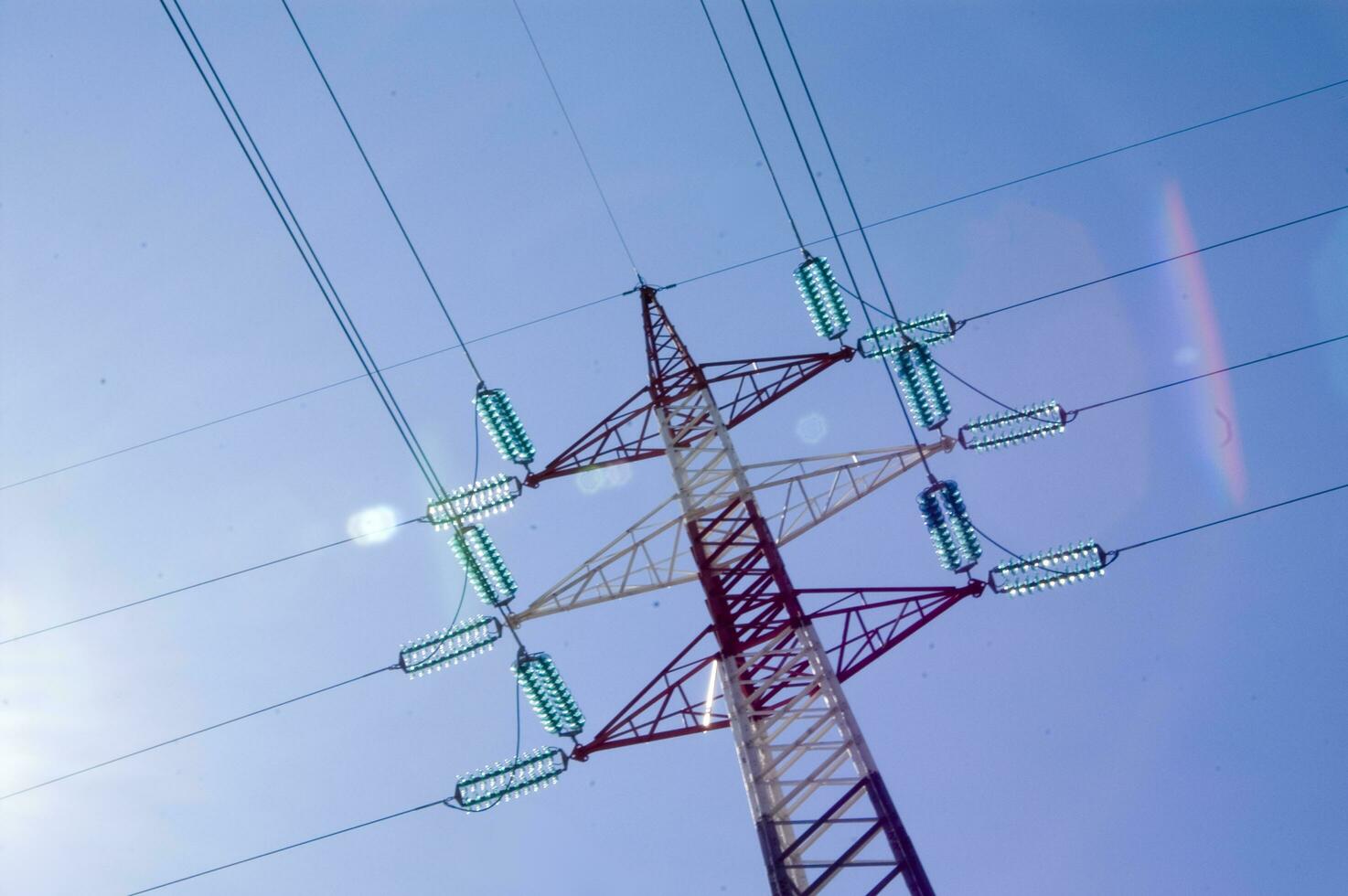 a high voltage power line with wires and poles photo