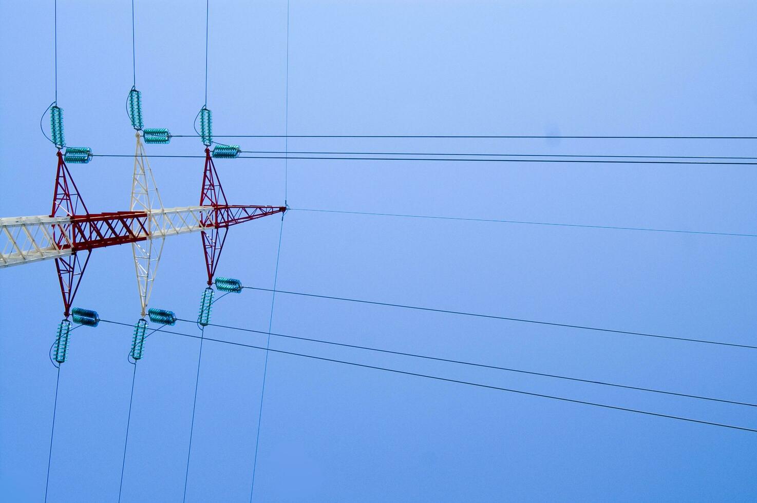 a high voltage power line with wires and poles photo