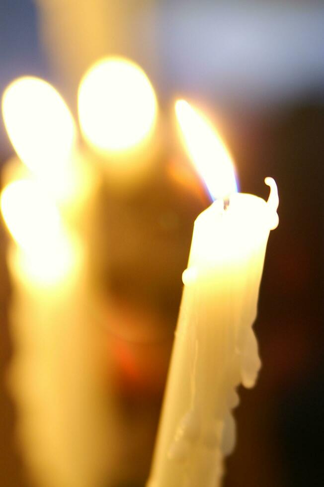 a close up of a lit candle photo