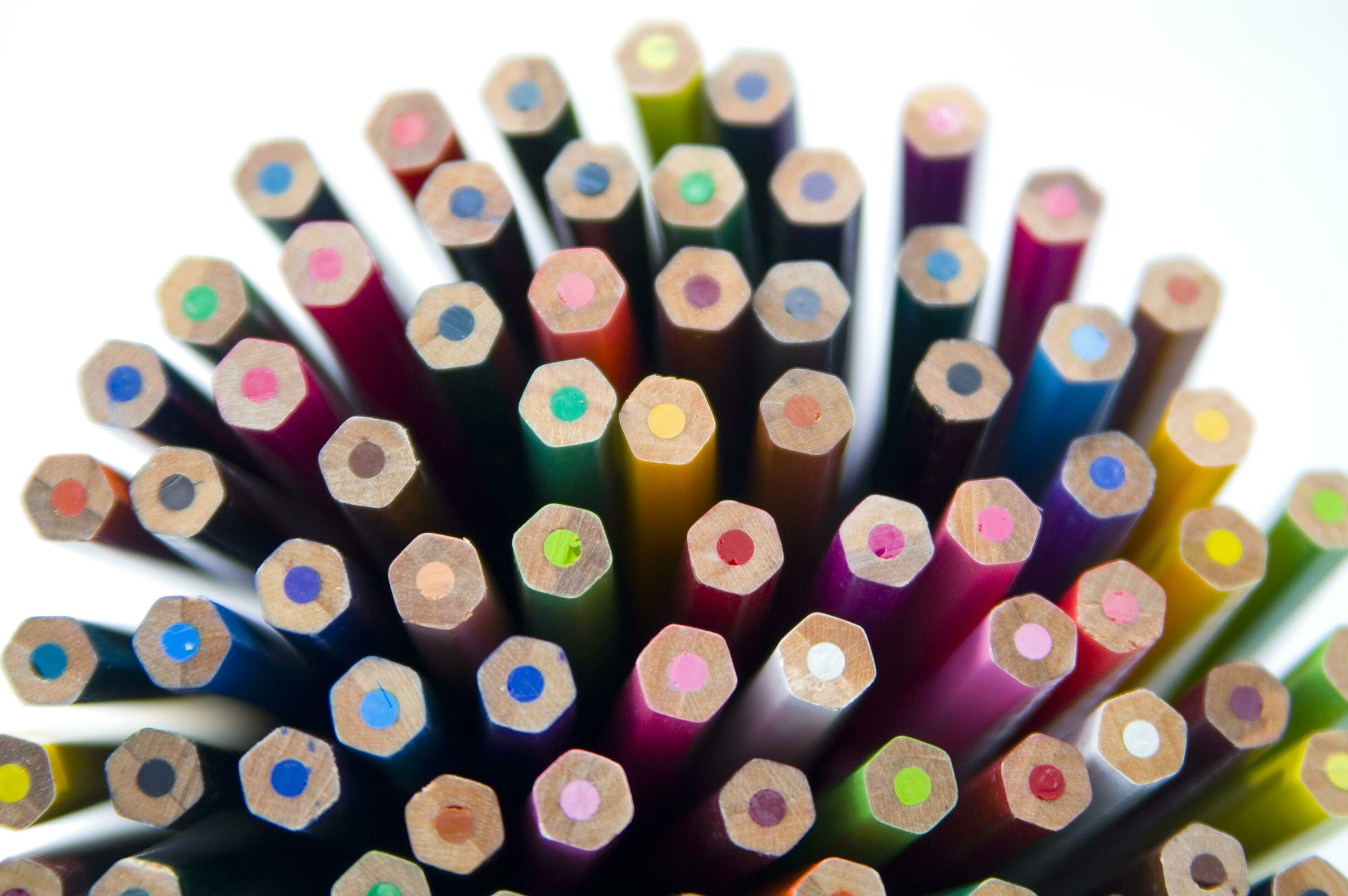many colored pencils are arranged in a row 27097443 Stock Photo at Vecteezy