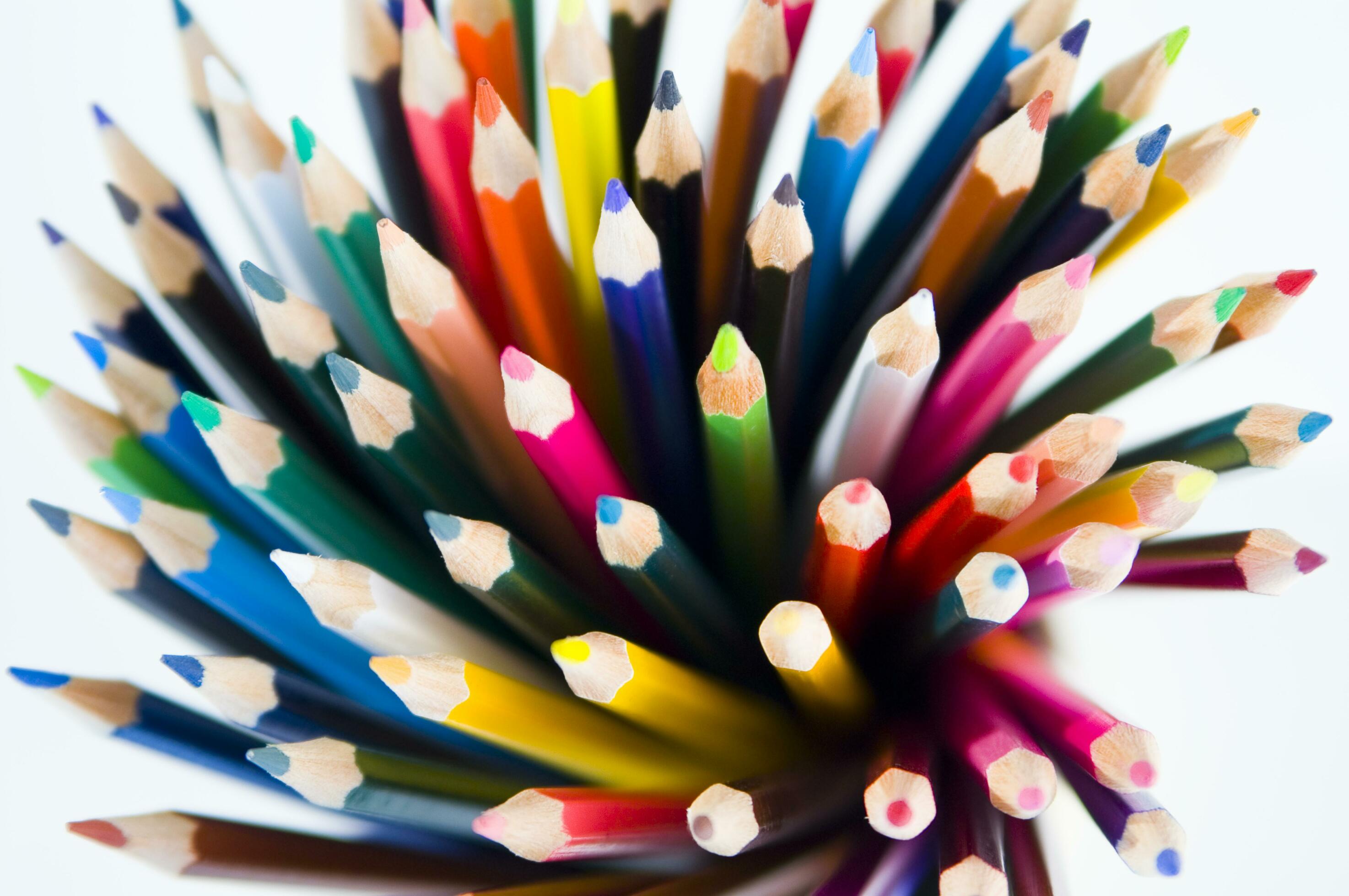 many colored pencils are arranged in a row 27097446 Stock Photo at Vecteezy
