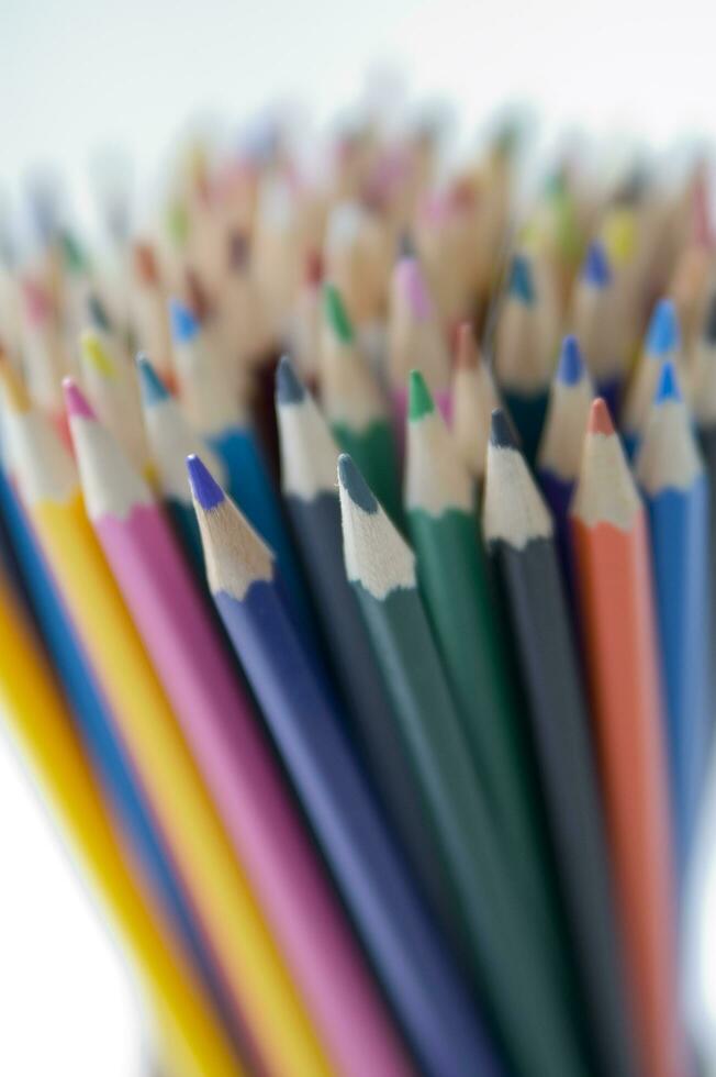 many colored pencils are arranged in a row 27097453 Stock Photo at Vecteezy