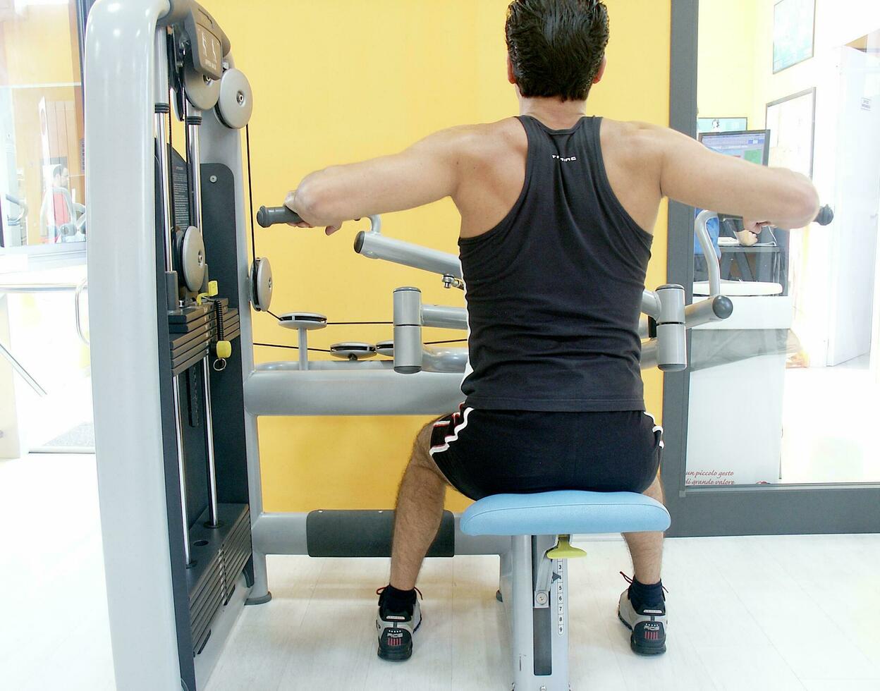 a row of dumbbells on a rack in a gym photo