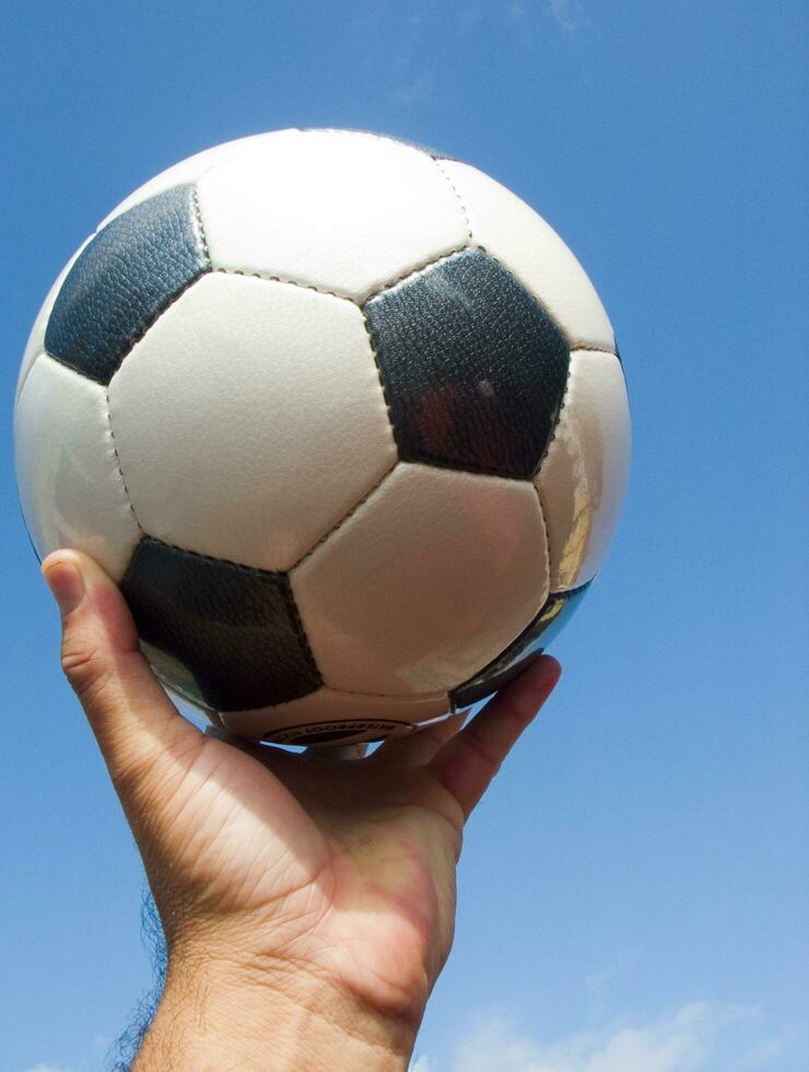 a close up of a soccer ball with leather photo