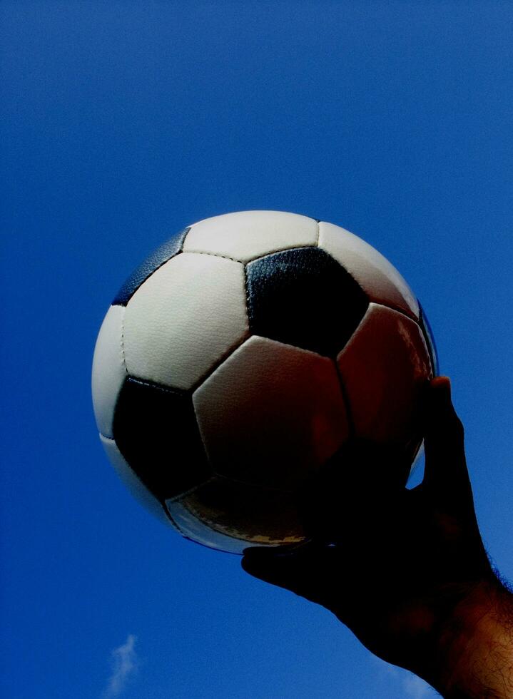 a close up of a soccer ball with leather photo