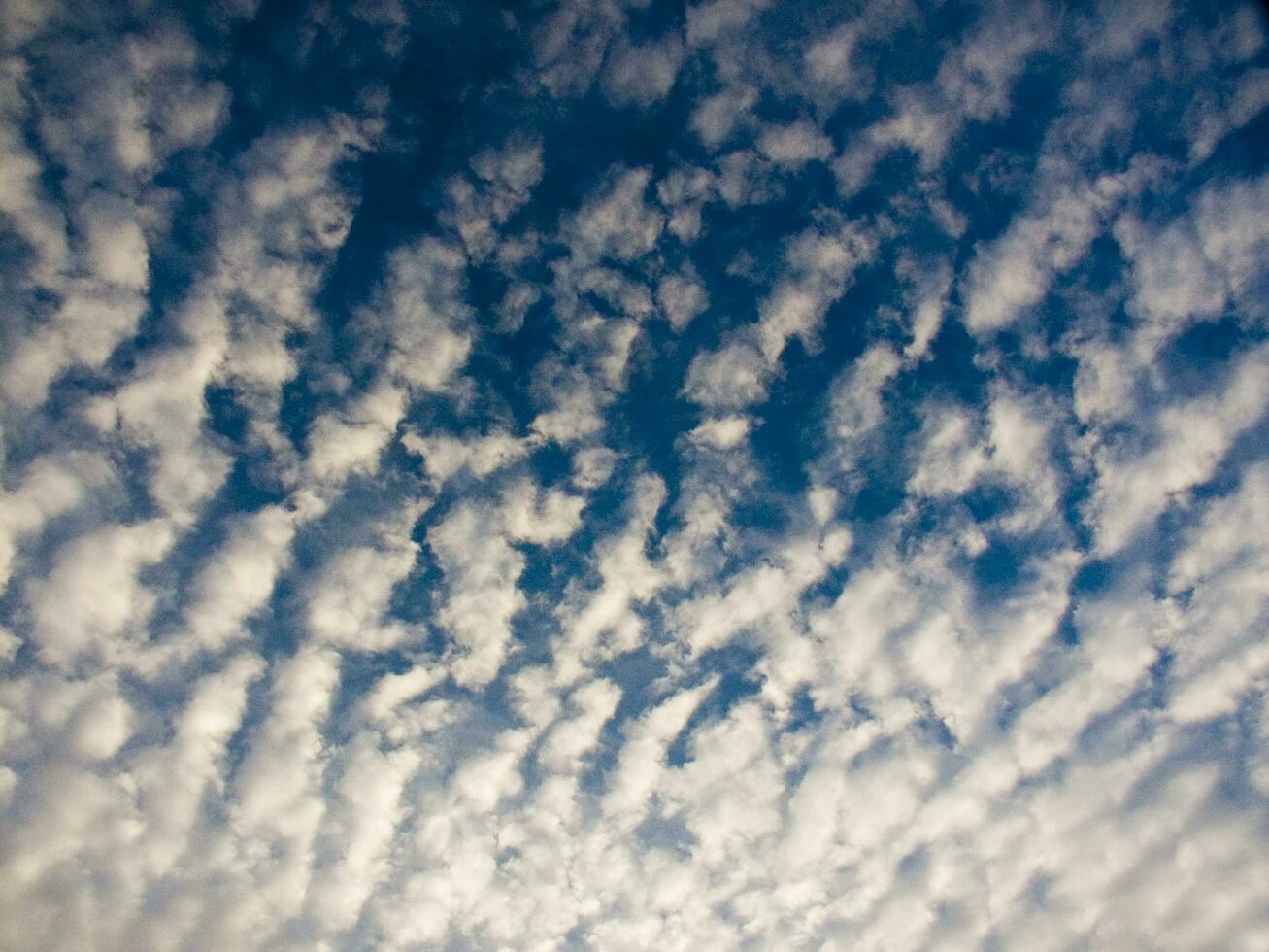 a view of the sky with clouds and sun photo