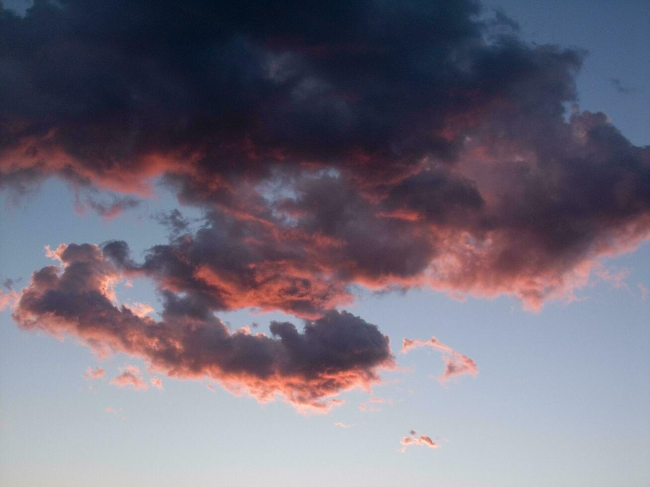 a jet plane flying through a cloudy sky photo