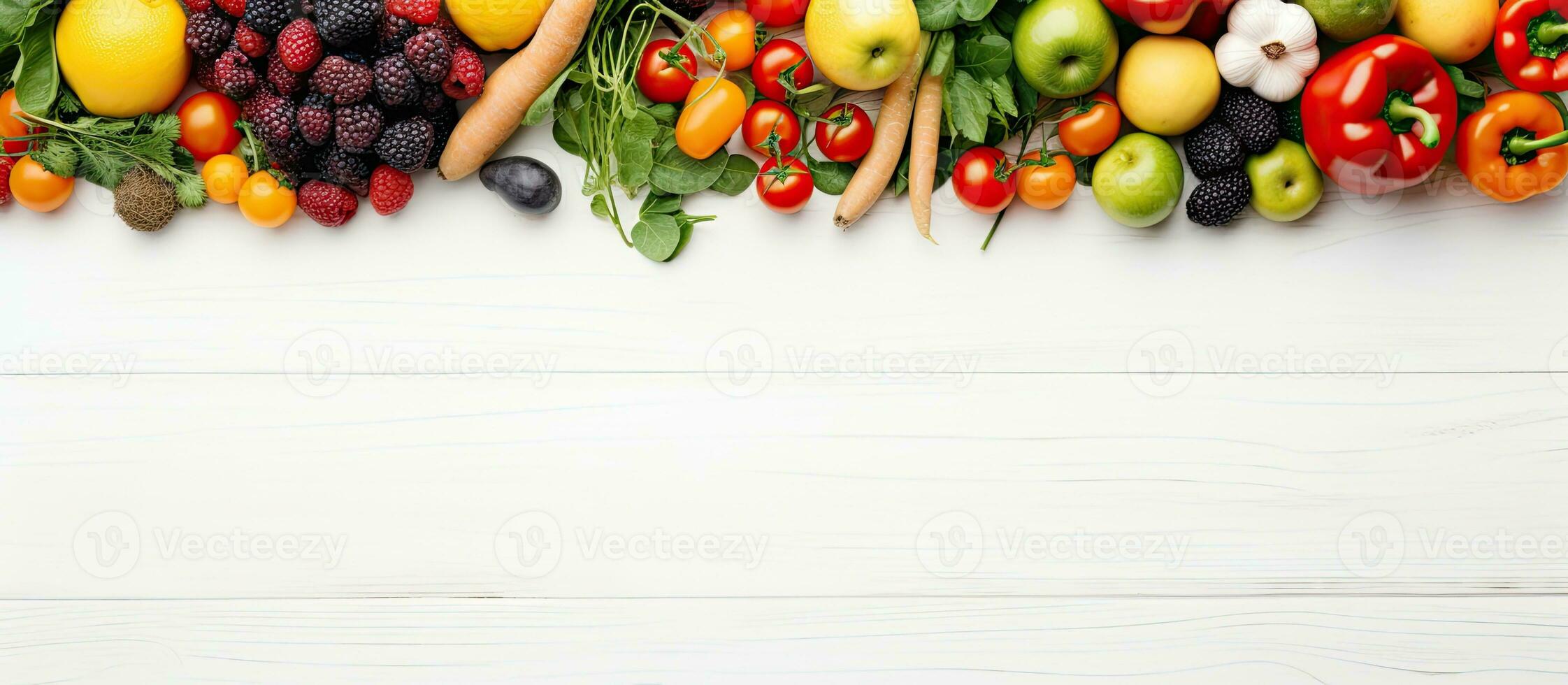 A variety of fruits and vegetables are displayed on a white wooden table background, ideal for photo