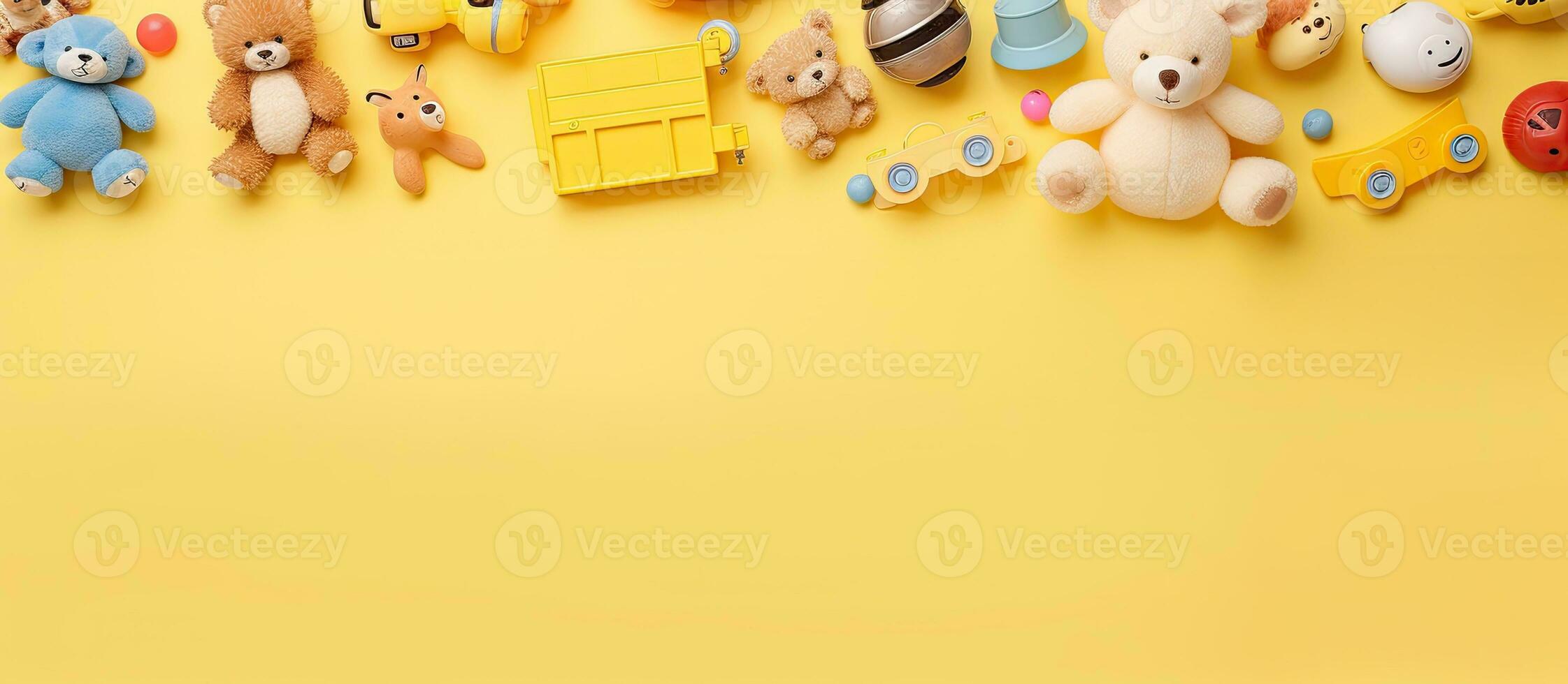 collection of baby and kids toys placed on a pastel yellow background. The photograph is taken photo