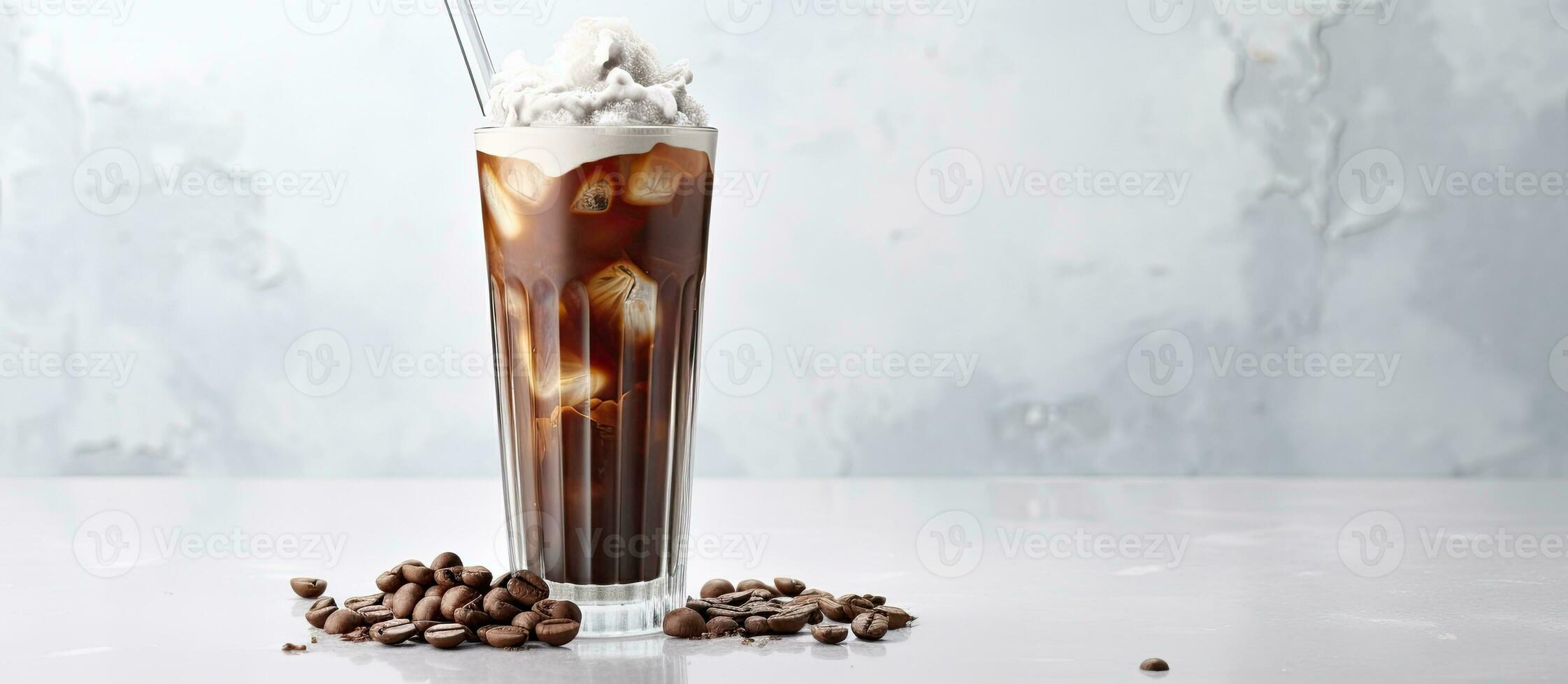 iced cocoa in a clear glass on a marble surface with space for your text photo