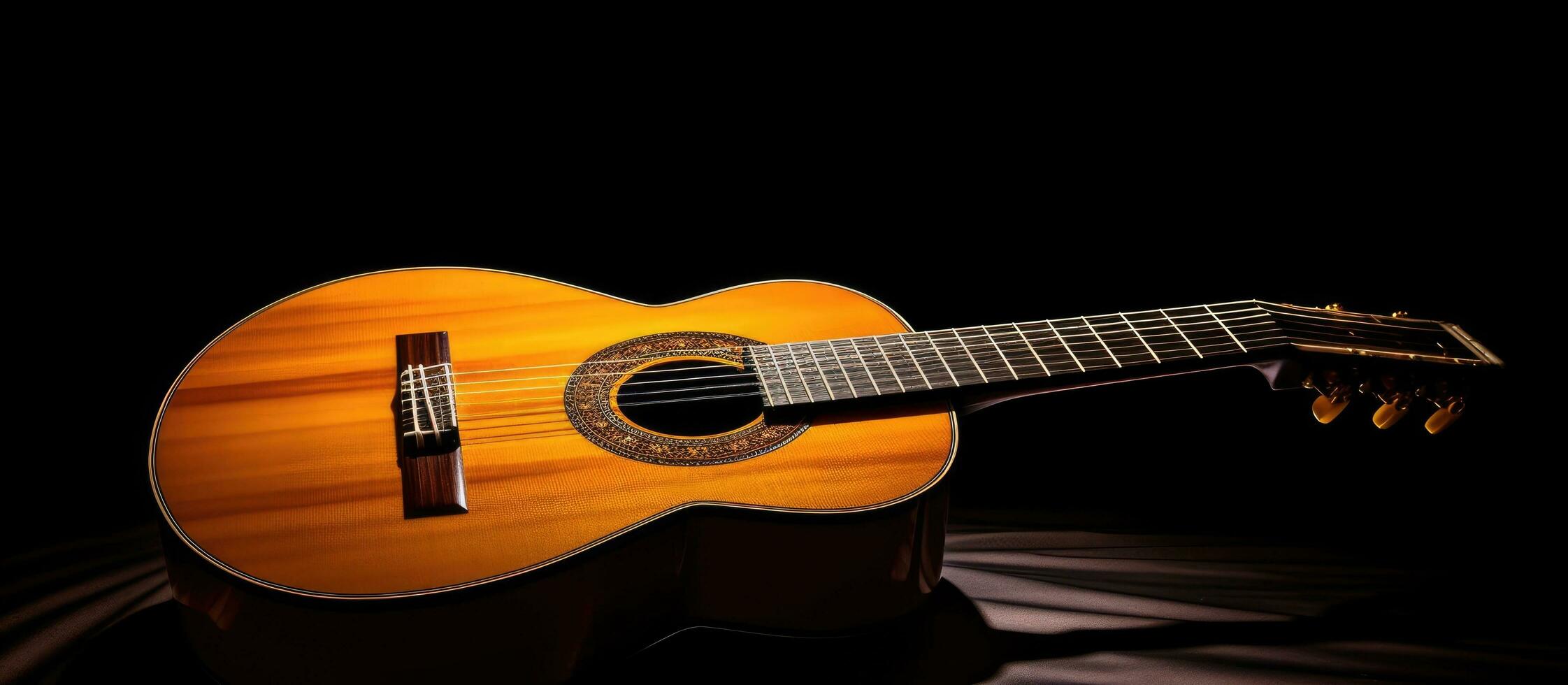 The classical guitar is shown in close-up, with dramatic lighting against a black background. There photo