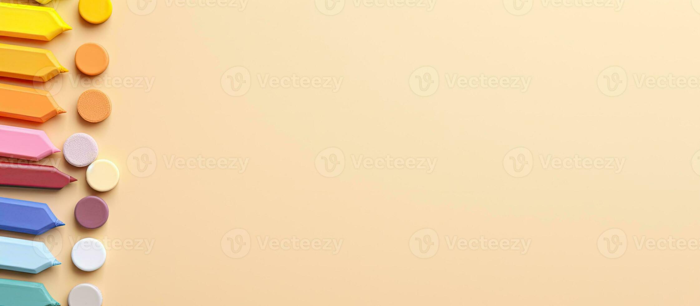 Top view of colored pencils on a light yellow background. Copy space and space for text. photo
